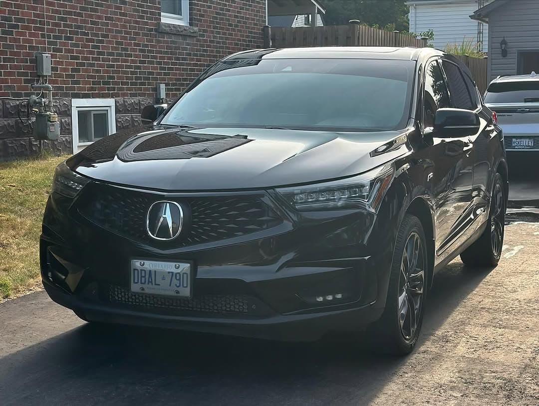 Black Acura RDX side profile after detail